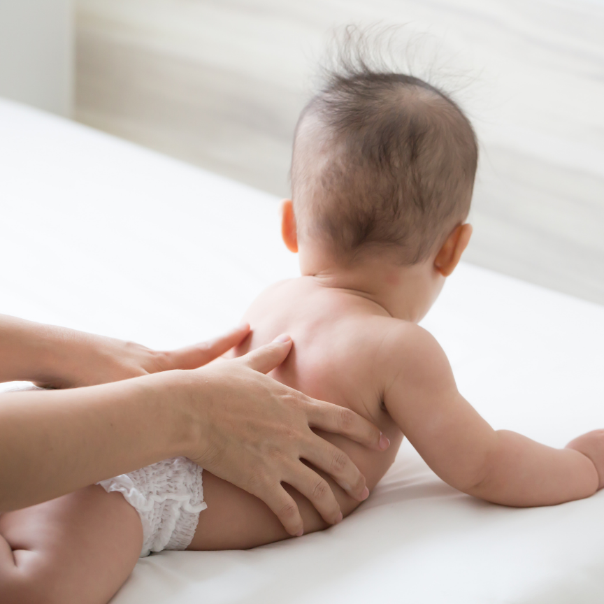 infant getting treatment during tummy time