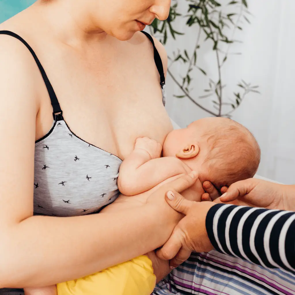 parent breastfeed a baby